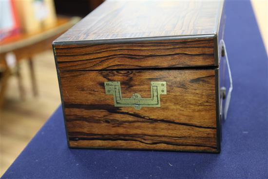 A Victorian brass inlaid rosewood travelling toilet box by Asprey containing ten engine turned silver mounted toilet jars,